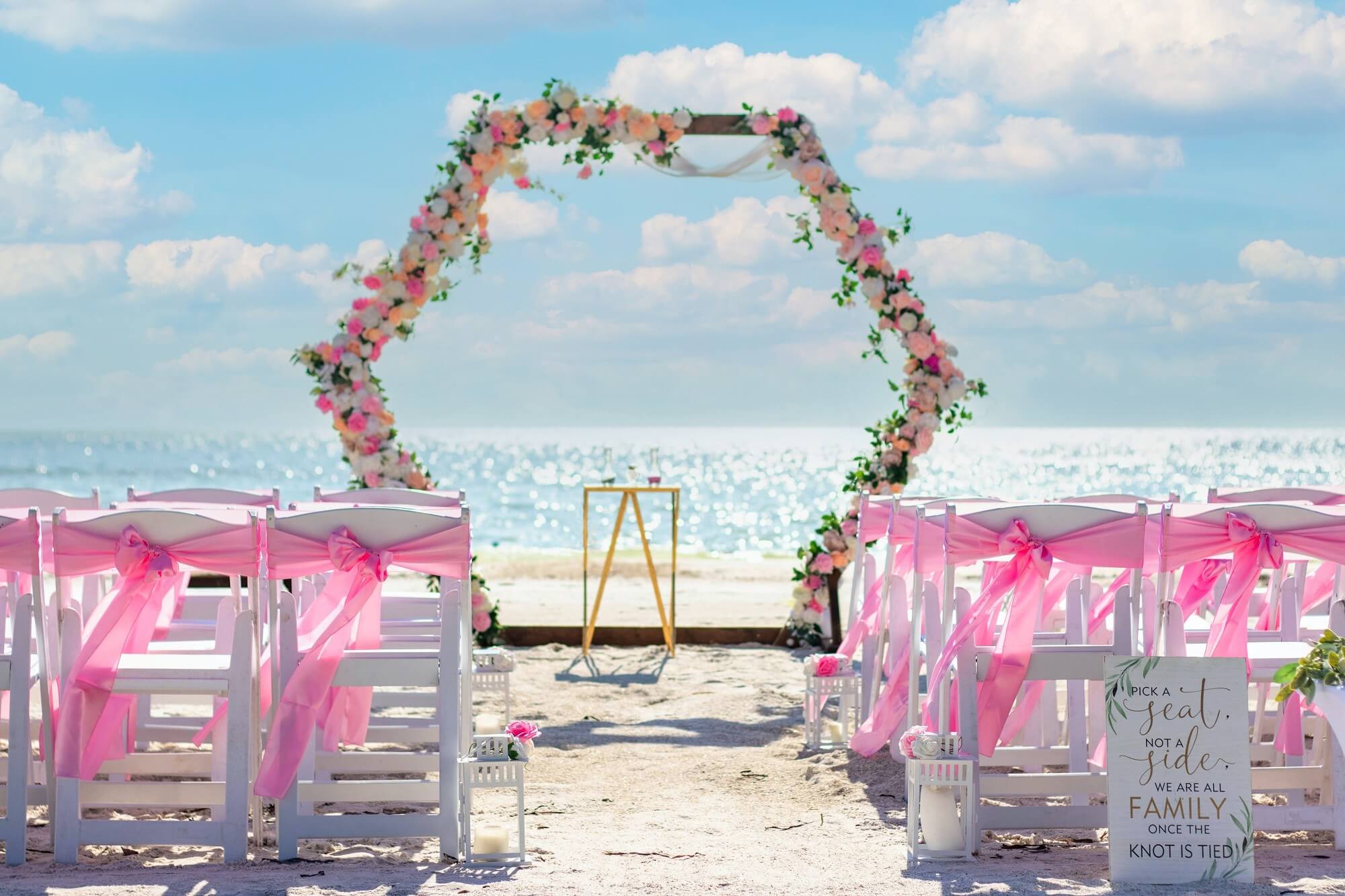 A fresh-flower beach wedding arch on the Gulf Coast